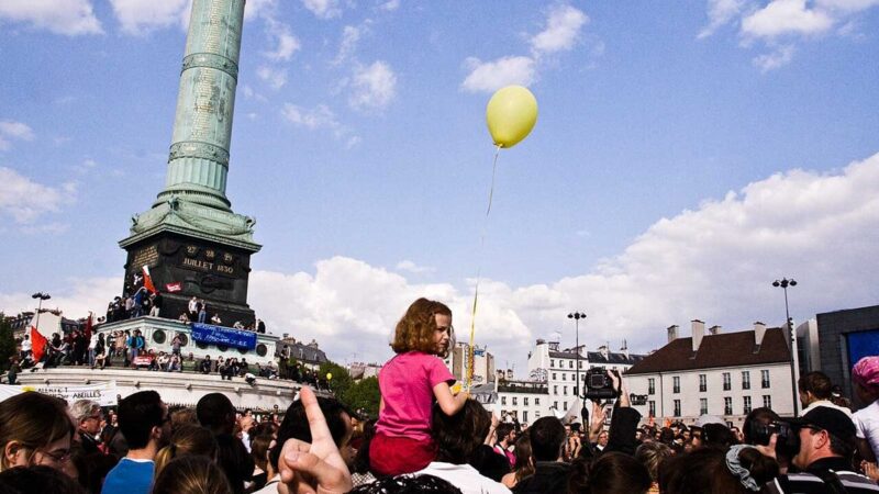 Crowd gathered at Place de la Bastille in Paris during a protest
