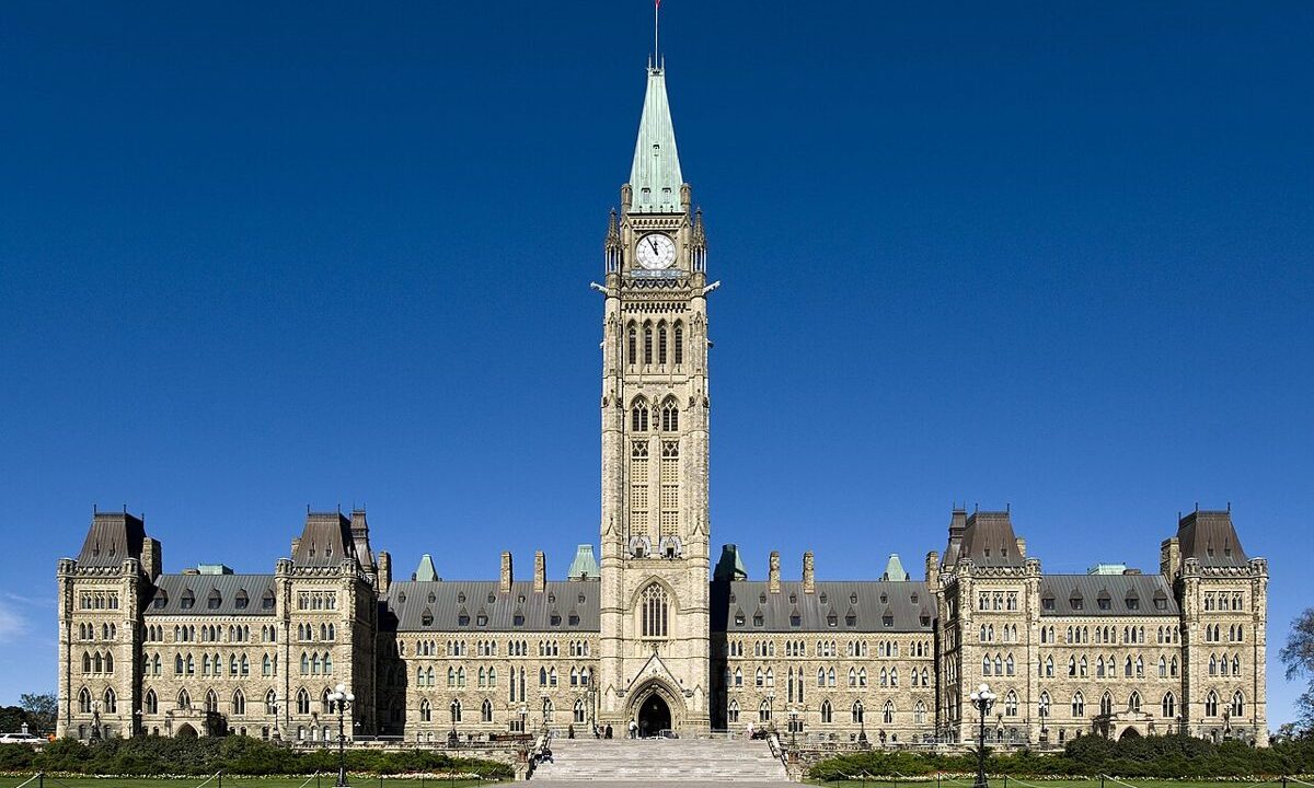 Parliament Hill in Ottawa with the Peace Tower against a blue sky