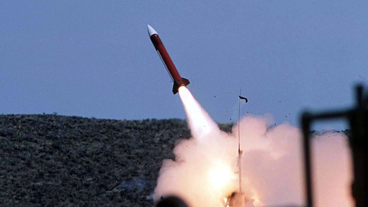 Patriot interceptor missile launching into a blue sky