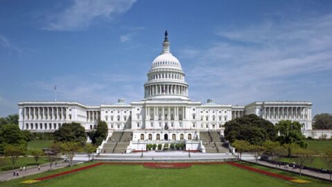 US Capitol building west front under blue sky